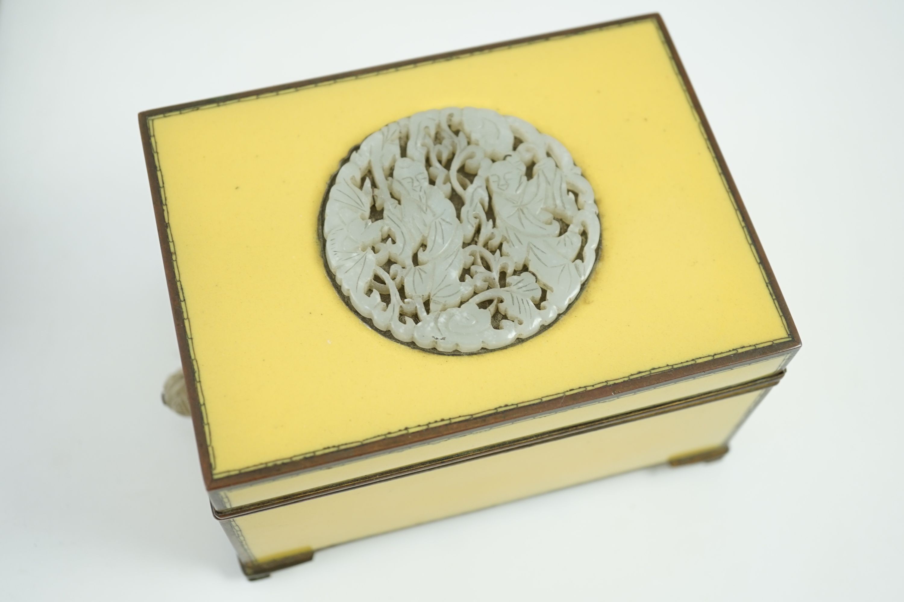 A Japanese cloisonné enamel desk set, 1920s, mounted with two Chinese Qing dynasty pale celadon jade plaques, retailed by Yamanaka & Co., Inkstand 31cm wide